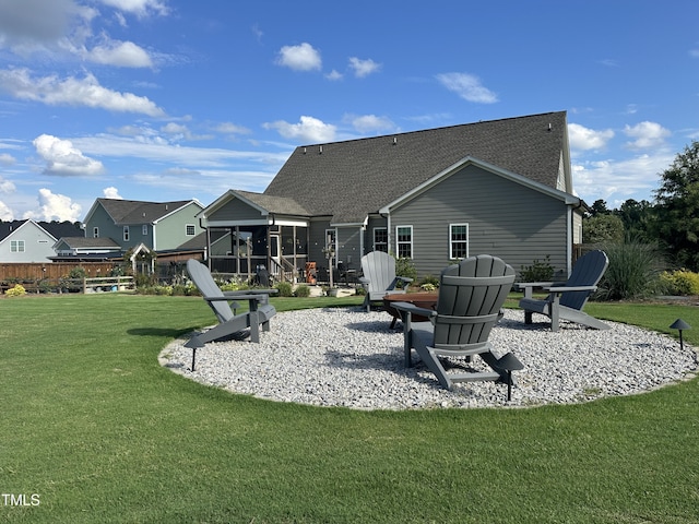 135 Meadow Lake Dr, Youngsville, NC 27596 - back of house with a sunroom, a shingled roof, and a yard