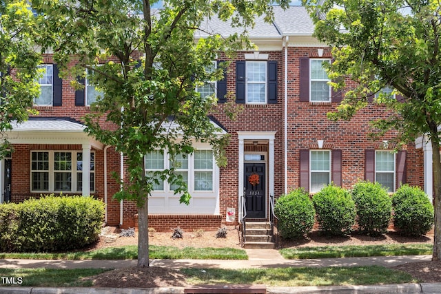 3634 Olympia Dr, Raleigh, NC 27603 - townhome / multi-family property featuring brick siding, entry steps, and roof with shingles