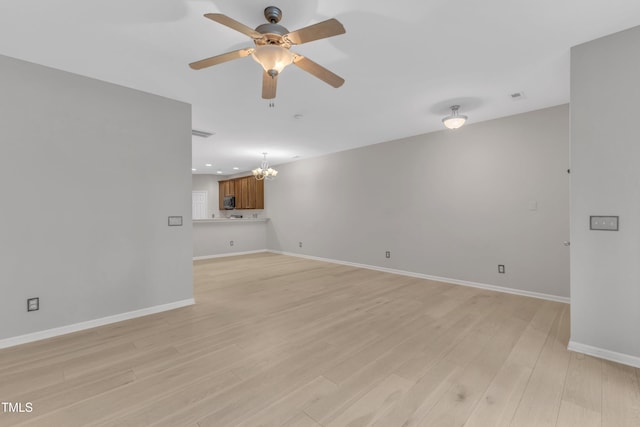3634 Olympia Dr, Raleigh, NC 27603 - spare room with a chandelier, a ceiling fan, light wood finished floors, and recessed lighting