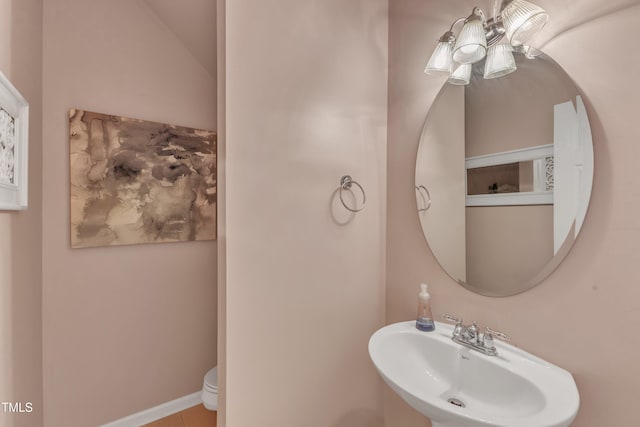 3634 Olympia Dr, Raleigh, NC 27603 - half bathroom featuring a sink and toilet