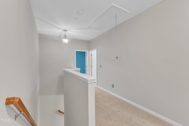 3634 Olympia Dr, Raleigh, NC 27603 - corridor featuring attic access, an upstairs landing, and carpet