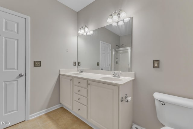 3634 Olympia Dr, Raleigh, NC 27603 - bathroom with double vanity, an enclosed shower, and tile patterned flooring