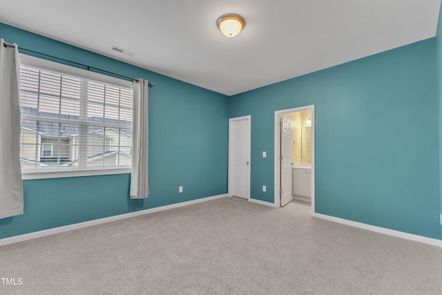 3634 Olympia Dr, Raleigh, NC 27603 - unfurnished bedroom featuring carpet and ensuite bath