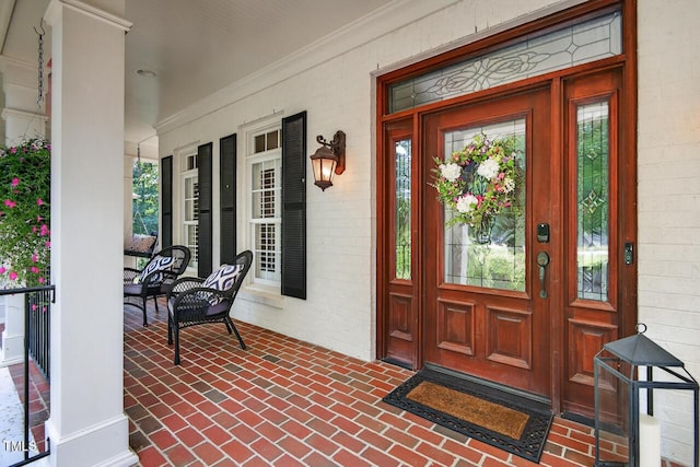 3748 Knollcreek Dr, Apex, NC 27539 - view of exterior entry with a porch and brick siding