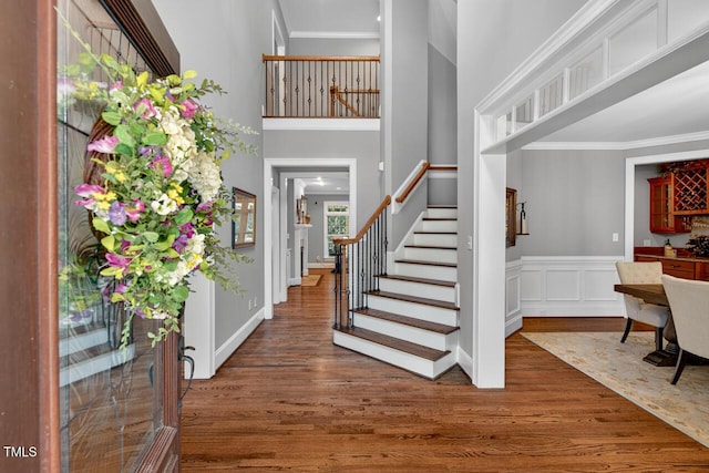 3748 Knollcreek Dr, Apex, NC 27539 - foyer entrance with wood finished floors, stairway, crown molding, and a towering ceiling