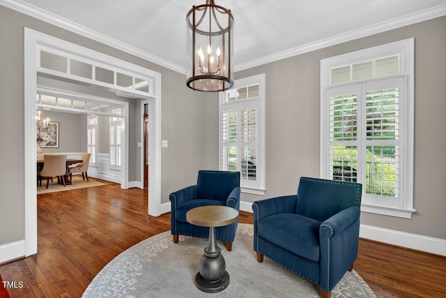 3748 Knollcreek Dr, Apex, NC 27539 - living area featuring a chandelier, wood finished floors, plenty of natural light, and crown molding