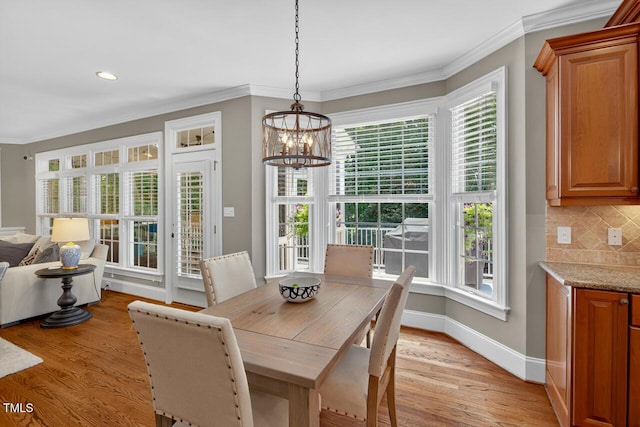 3748 Knollcreek Dr, Apex, NC 27539 - dining room featuring light wood finished floors, a chandelier, ornamental molding, and recessed lighting