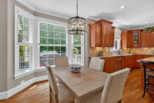 3748 Knollcreek Dr, Apex, NC 27539 - dining room with a chandelier, crown molding, light wood-style flooring, and recessed lighting