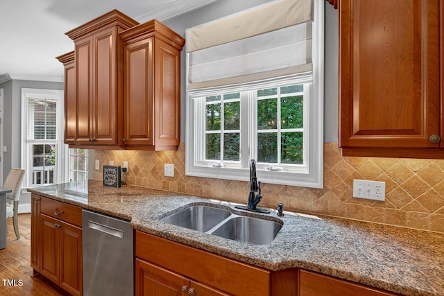 3748 Knollcreek Dr, Apex, NC 27539 - kitchen featuring stainless steel dishwasher, ornamental molding, stone counters, brown cabinetry, and backsplash