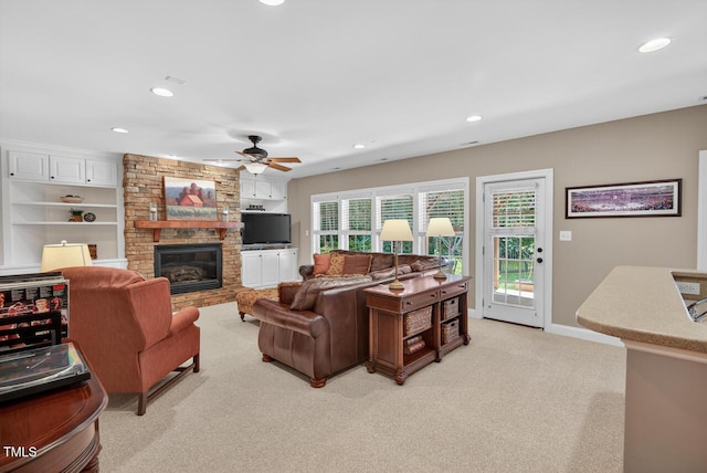 3748 Knollcreek Dr, Apex, NC 27539 - living room featuring light carpet, recessed lighting, a ceiling fan, and a fireplace