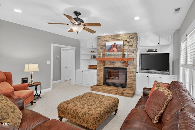 3748 Knollcreek Dr, Apex, NC 27539 - living room featuring ceiling fan, light colored carpet, a stone fireplace, built in shelves, and recessed lighting