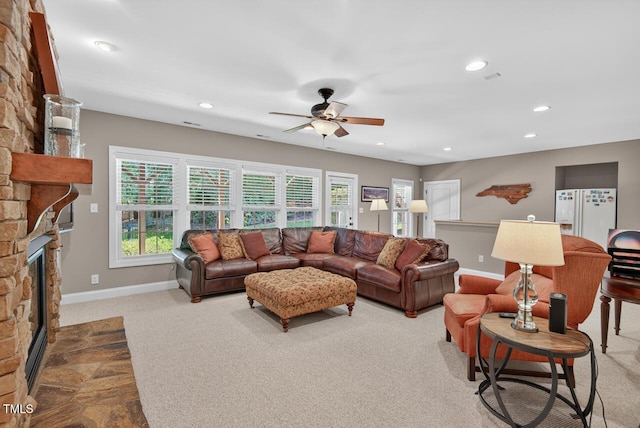 3748 Knollcreek Dr, Apex, NC 27539 - carpeted living area featuring a fireplace, ceiling fan, and recessed lighting