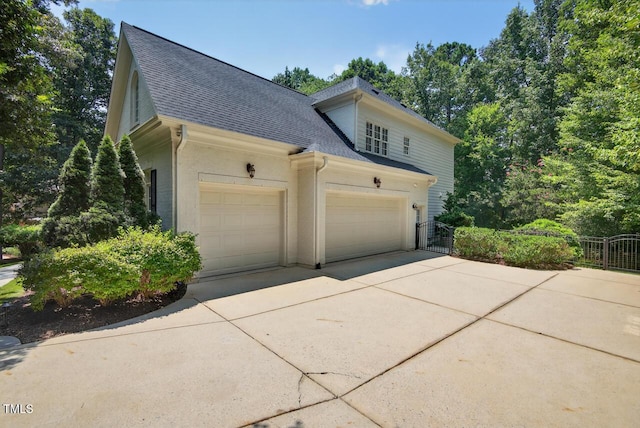3748 Knollcreek Dr, Apex, NC 27539 - view of property exterior with a shingled roof, driveway, and a garage