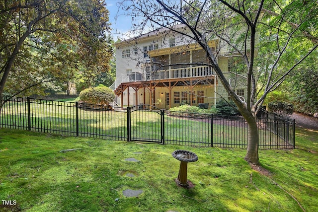 3748 Knollcreek Dr, Apex, NC 27539 - rear view of house with a fenced backyard, a deck, a gate, and an attached garage