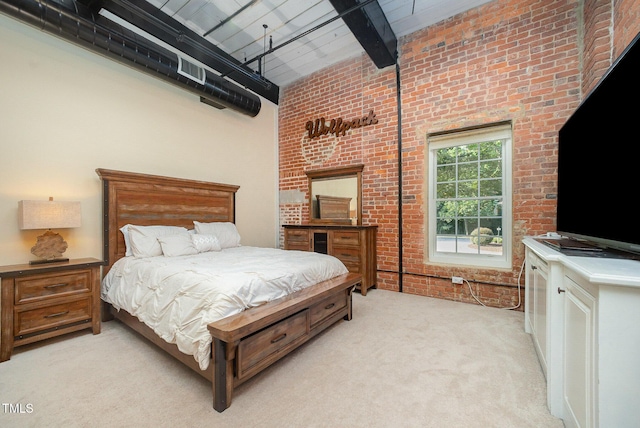 1535 Caraleigh Mills Ct Unit 142, Raleigh, NC 27603 - bedroom with brick wall, light carpet, a towering ceiling, and beam ceiling