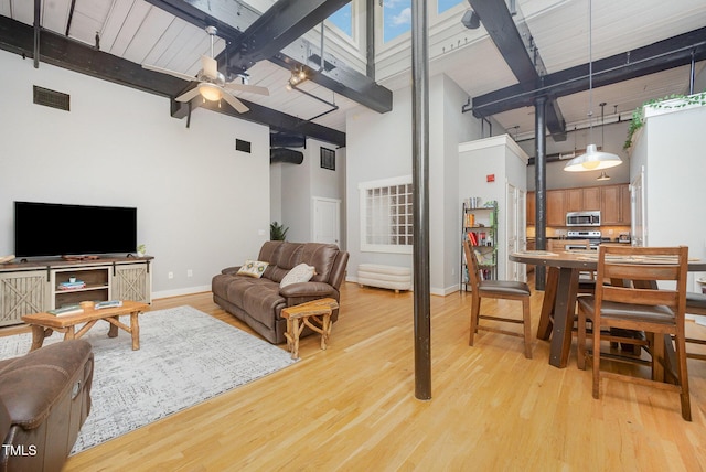 1535 Caraleigh Mills Ct Unit 142, Raleigh, NC 27603 - living room with a high ceiling, beam ceiling, light wood-style flooring, and a ceiling fan