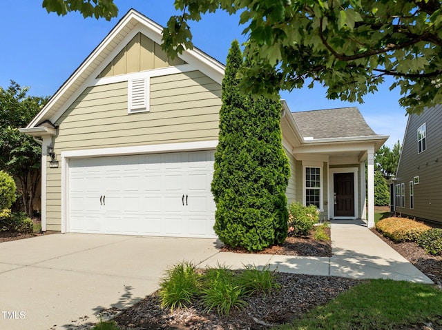 1704 Horne Creek Dr, Durham, NC 27703 - view of front facade with a garage, driveway, and roof with shingles