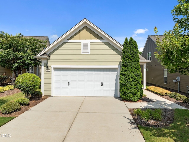 1704 Horne Creek Dr, Durham, NC 27703 - view of front of house with concrete driveway, board and batten siding, and a garage
