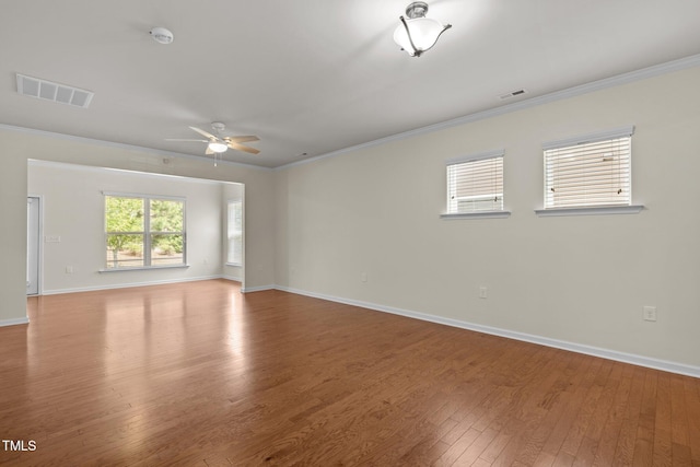 1704 Horne Creek Dr, Durham, NC 27703 - spare room with wood finished floors, crown molding, a ceiling fan, and a smoke detector