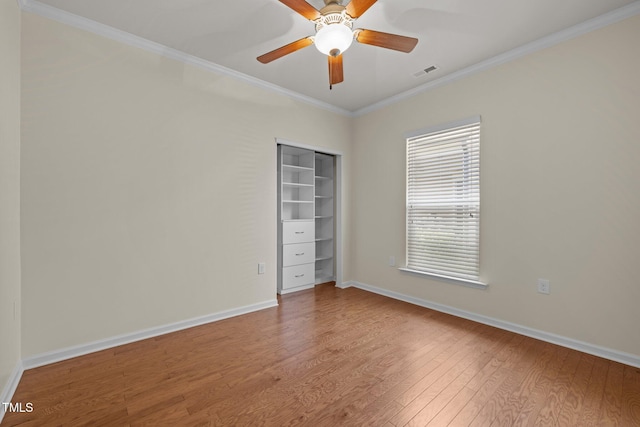 1704 Horne Creek Dr, Durham, NC 27703 - unfurnished bedroom with wood finished floors, ornamental molding, a closet, and a ceiling fan
