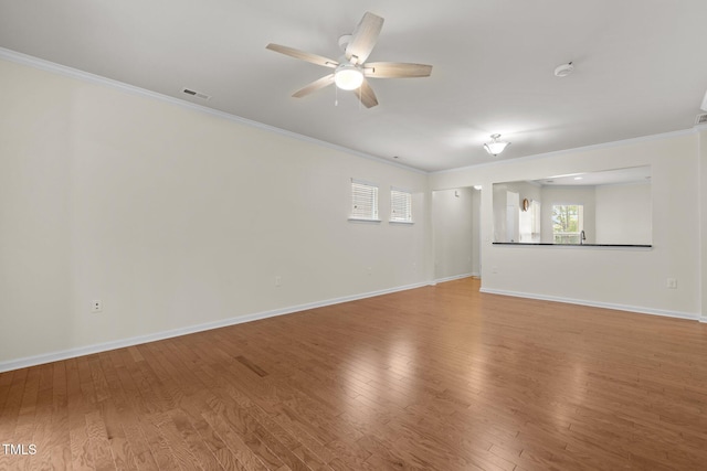 1704 Horne Creek Dr, Durham, NC 27703 - unfurnished room featuring crown molding, a ceiling fan, light wood-style flooring, healthy amount of natural light, and a smoke detector