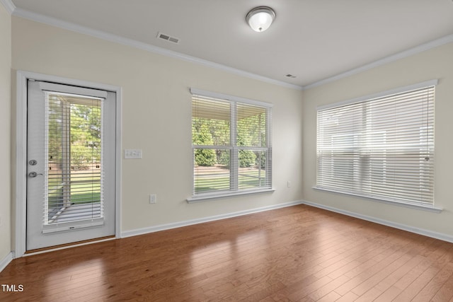 1704 Horne Creek Dr, Durham, NC 27703 - empty room with ornamental molding and hardwood / wood-style flooring