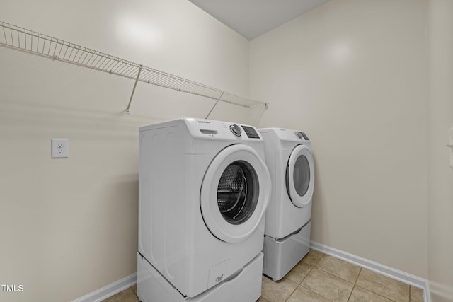 1704 Horne Creek Dr, Durham, NC 27703 - laundry area featuring washer and dryer and light tile patterned floors