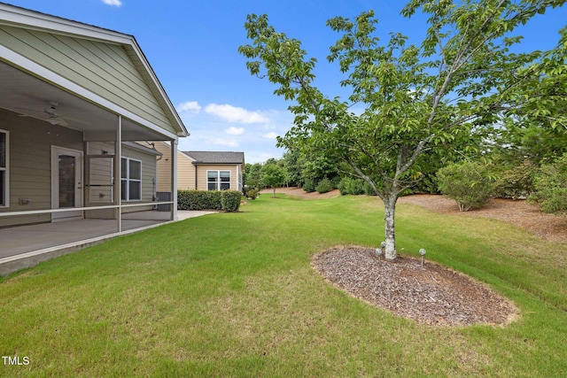 1704 Horne Creek Dr, Durham, NC 27703 - view of grassy yard with a ceiling fan and a patio