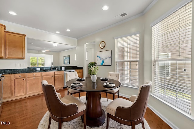 1704 Horne Creek Dr, Durham, NC 27703 - dining room with wood finished floors, ornamental molding, and recessed lighting