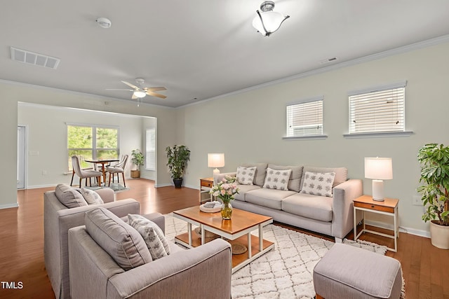 1704 Horne Creek Dr, Durham, NC 27703 - living area with crown molding, wood finished floors, and a ceiling fan