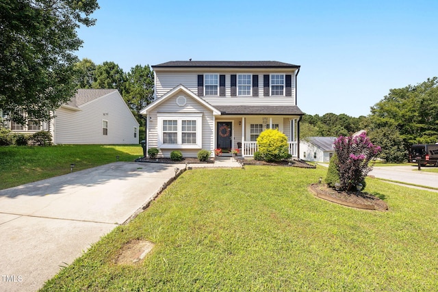 117 Gladstone Dr, Durham, NC 27703 - traditional-style home featuring covered porch and a front yard