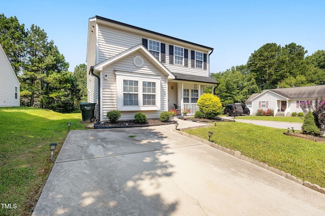 117 Gladstone Dr, Durham, NC 27703 - traditional-style house with covered porch and a front yard