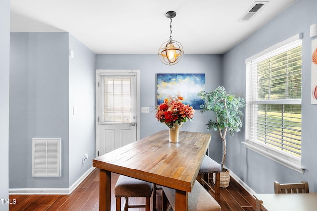 117 Gladstone Dr, Durham, NC 27703 - dining area with dark wood-type flooring and baseboards