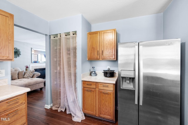 117 Gladstone Dr, Durham, NC 27703 - kitchen with stainless steel fridge, dark wood-type flooring, and light countertops