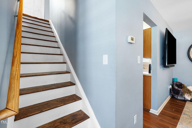 117 Gladstone Dr, Durham, NC 27703 - stairway featuring wood finished floors and baseboards
