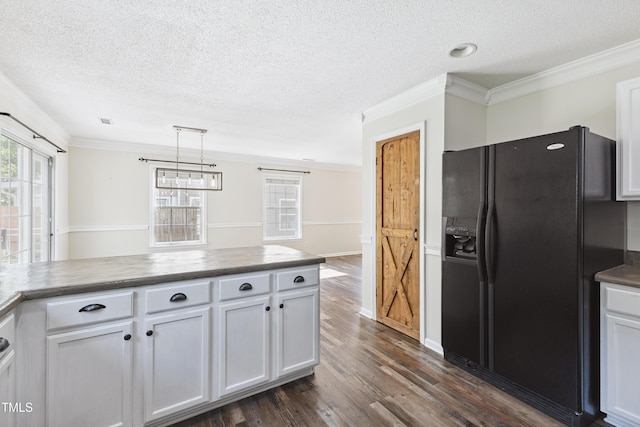 328 Palmdale Ct, Holly Springs, NC 27540 - kitchen with black fridge with ice dispenser, a textured ceiling, crown molding, dark wood finished floors, and dark countertops