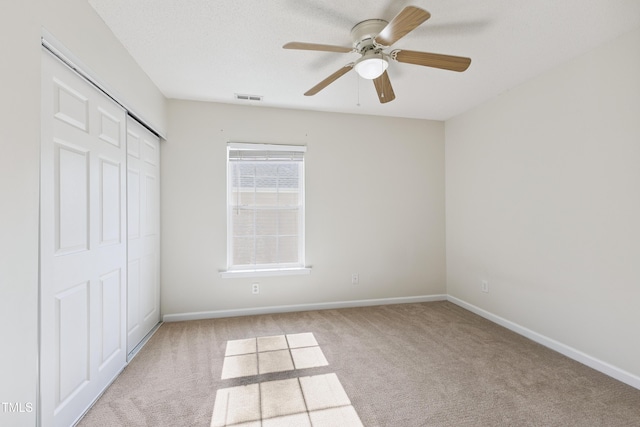 328 Palmdale Ct, Holly Springs, NC 27540 - unfurnished bedroom featuring carpet, a closet, and a ceiling fan