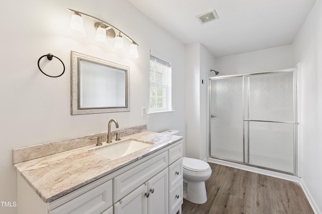 328 Palmdale Ct, Holly Springs, NC 27540 - full bathroom with a stall shower, vanity, and wood finished floors