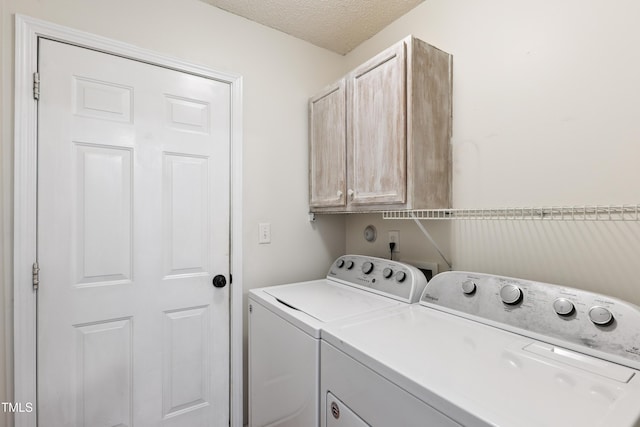 328 Palmdale Ct, Holly Springs, NC 27540 - washroom with cabinet space, washer and clothes dryer, and a textured ceiling