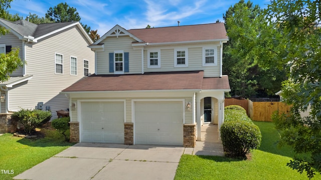 328 Palmdale Ct, Holly Springs, NC 27540 - view of front facade featuring driveway, an attached garage, stone siding, and a shingled roof