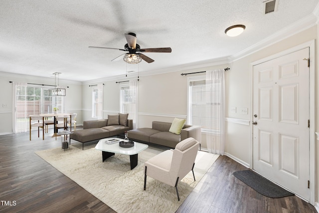 328 Palmdale Ct, Holly Springs, NC 27540 - living area with ceiling fan, dark wood-style flooring, ornamental molding, and a textured ceiling