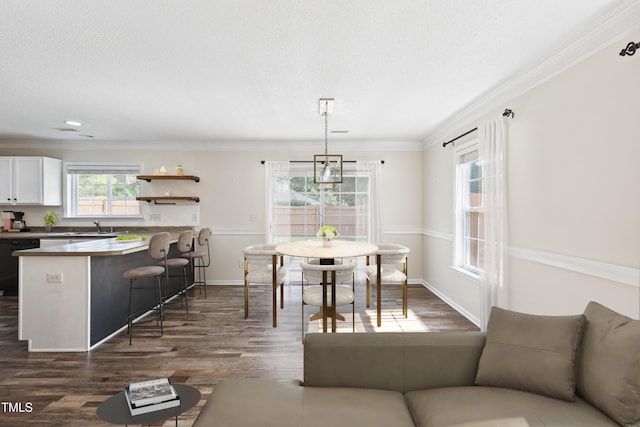 328 Palmdale Ct, Holly Springs, NC 27540 - dining space featuring dark wood-style floors and ornamental molding