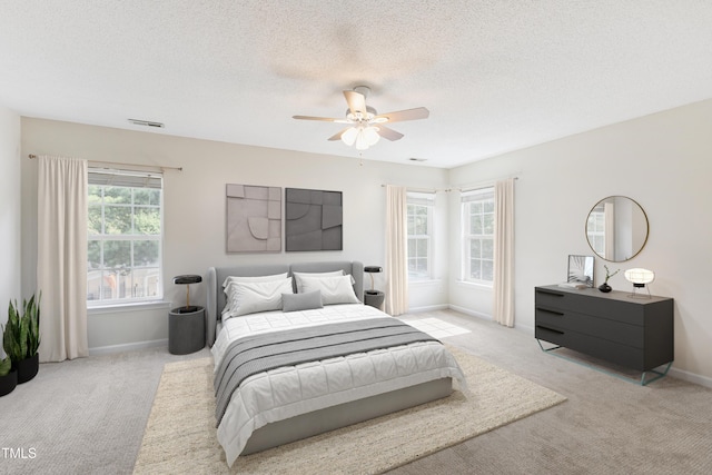 328 Palmdale Ct, Holly Springs, NC 27540 - bedroom with light colored carpet, ceiling fan, and a textured ceiling
