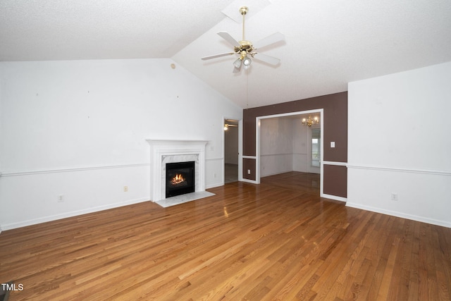 413 S Fayetteville St, Clayton, NC 27520 - unfurnished living room featuring a fireplace, a chandelier, light wood-style floors, ceiling fan, and lofted ceiling