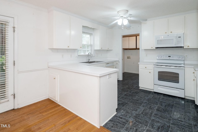 413 S Fayetteville St, Clayton, NC 27520 - kitchen with white appliances, a peninsula, white cabinetry, a ceiling fan, and crown molding