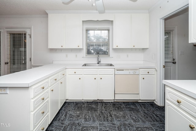 413 S Fayetteville St, Clayton, NC 27520 - kitchen with dishwasher, light countertops, a peninsula, white cabinetry, and crown molding