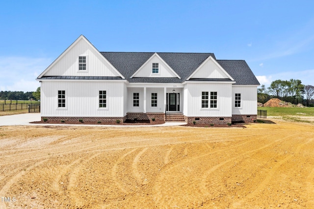2379 Heartland Rd, Battleboro, NC 27809 - view of front facade with crawl space, a shingled roof, a standing seam roof, and a porch