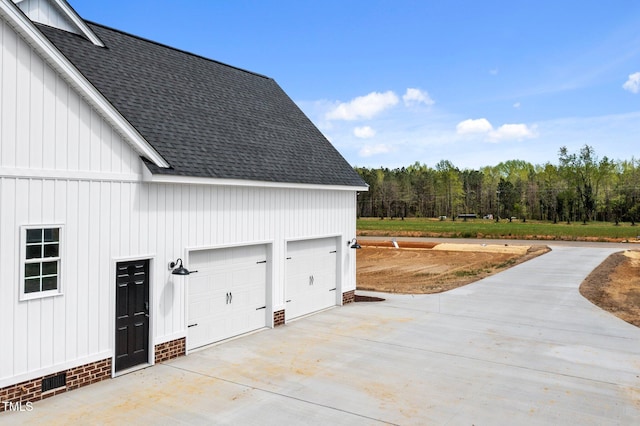 2379 Heartland Rd, Battleboro, NC 27809 - garage featuring concrete driveway and a forest view