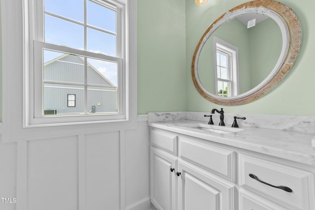 2379 Heartland Rd, Battleboro, NC 27809 - bathroom with vanity, a wainscoted wall, and a decorative wall