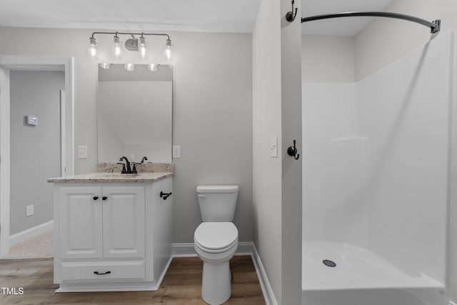 2379 Heartland Rd, Battleboro, NC 27809 - full bathroom featuring wood finished floors, vanity, and a shower